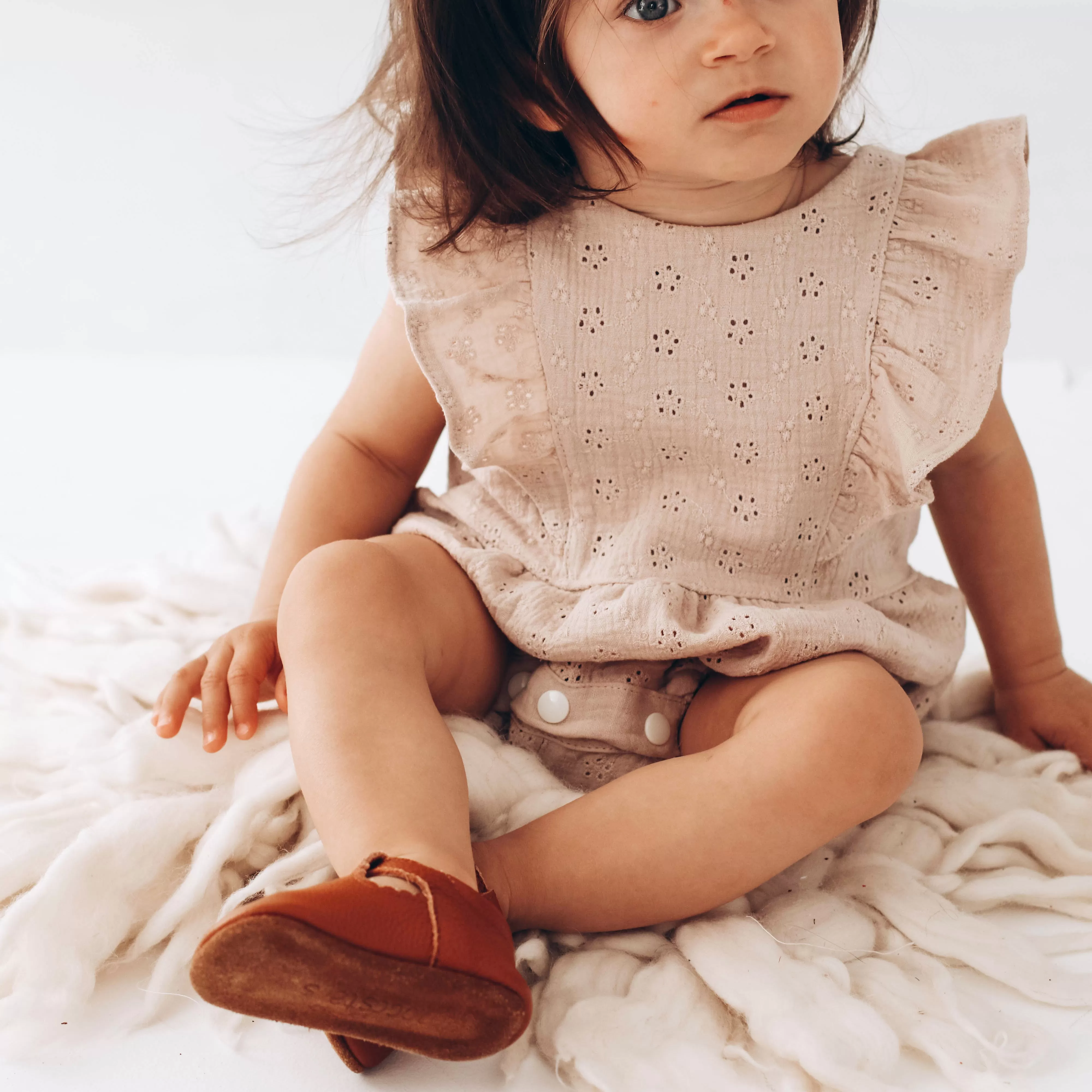 Embroidered muslin romper with frills