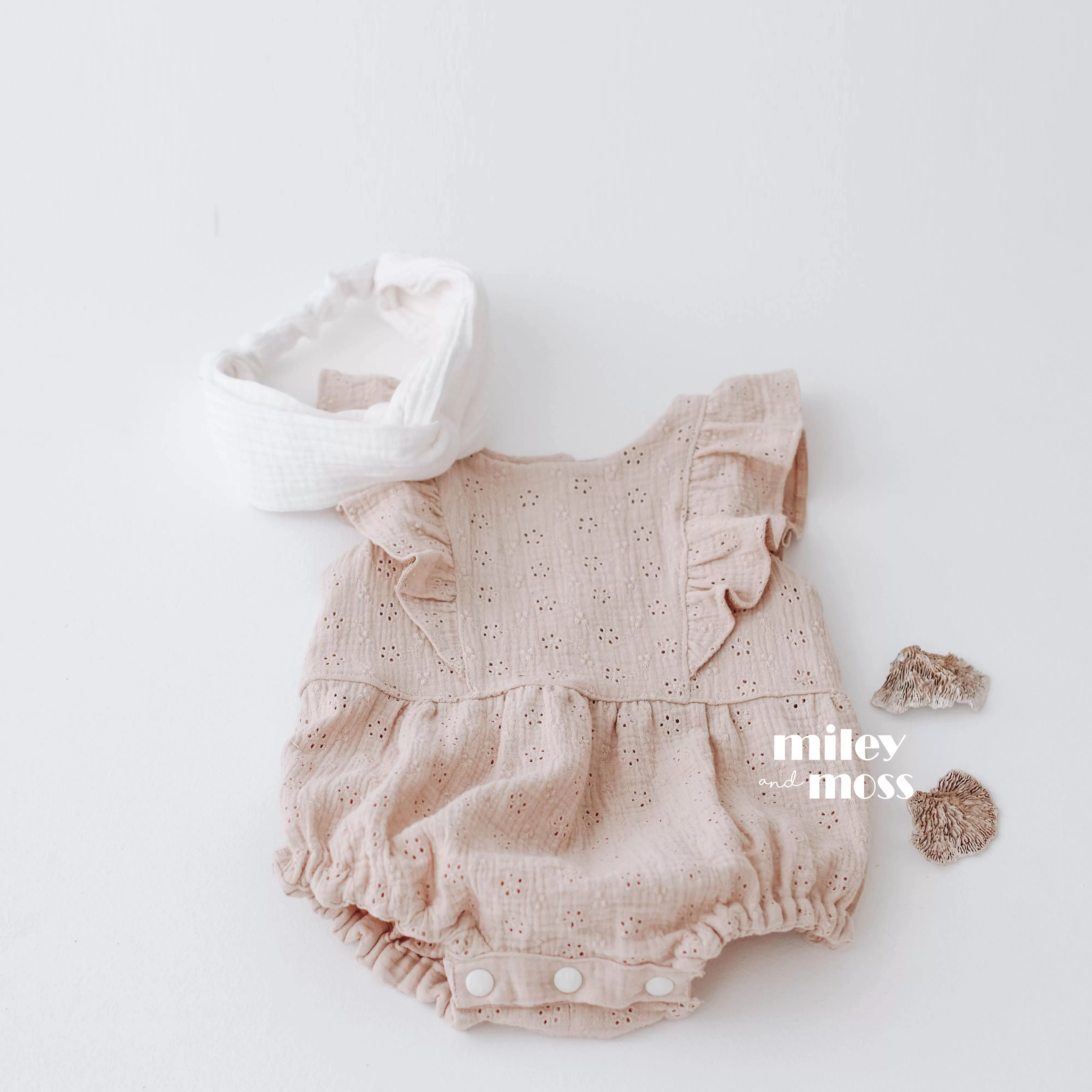 Embroidered muslin romper with frills