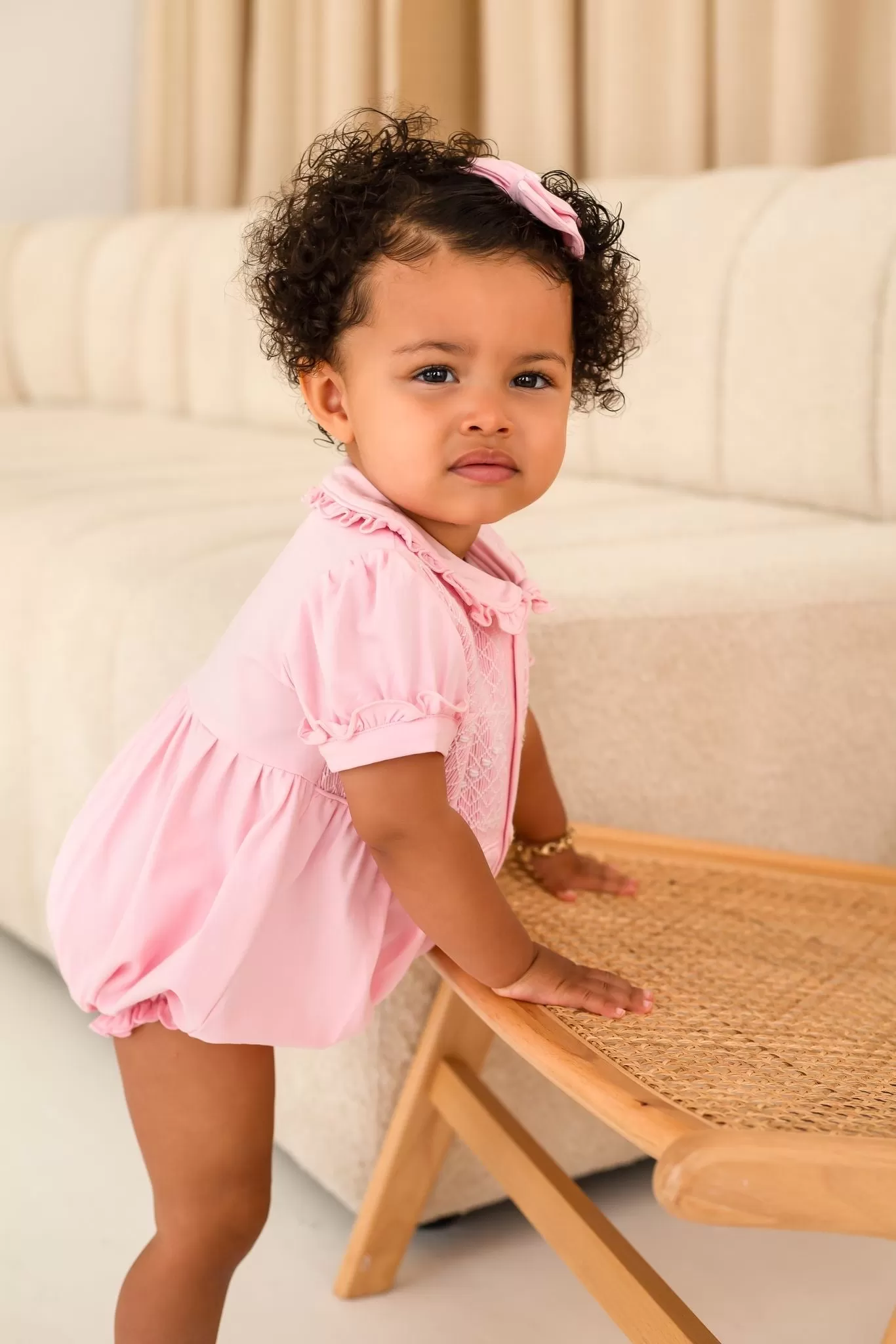 Girls Pink Smocked Romper Trimmed With White