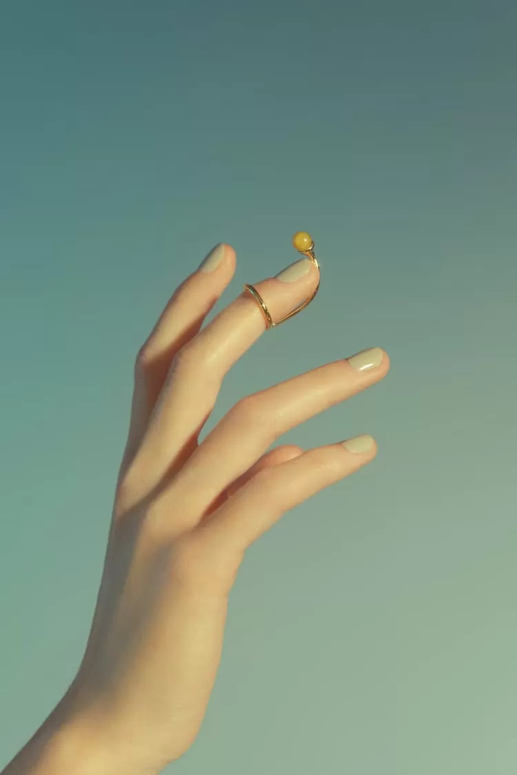 Gold nail ring with stone